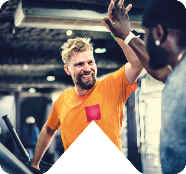 two men at gym high giving