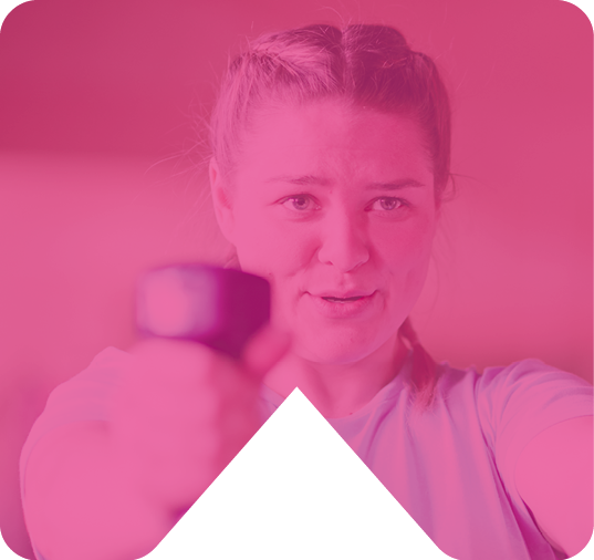 GIRL HOLDING DUMBELLS IN GYM